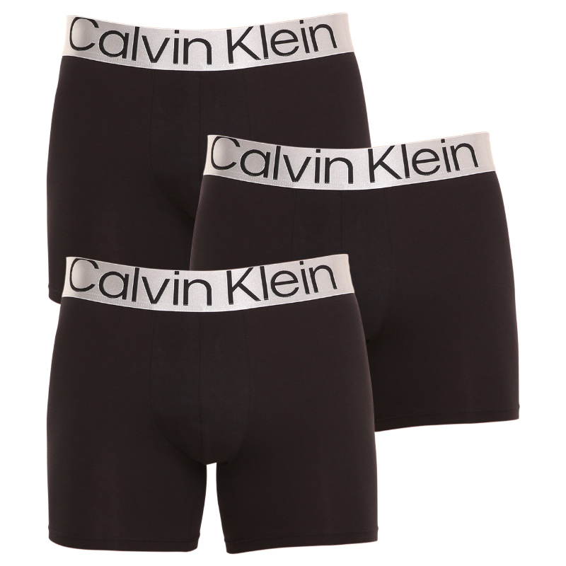 3PACK Herren Klassische Boxershorts Calvin Klein schwarz (NB3131A-7V1) M.
Genießen Sie ultimativen Komfort und Luxus mit den Calvin Klein Boxershorts für Männer in elegantem Schwarz.
Hochwertiges Material für ganztägigen Komfort
Die Boxershorts sind aus einer hochwertigen Mischung aus Baumwolle und Elastan gefertigt.
Elegantes Design und praktischer Schnitt
Die schwarze Farbe und der gewebte Gummizug mit kontrastierendem Calvin Klein-Logo sorgen für einen stilvollen und zeitlosen Look.
Warum Sie Calvin Klein Boxershorts lieben werden

Hochwertiges Material: Die Kombination aus Baumwolle und Elastan sorgt für Weichheit, Atmungsaktivität und Flexibilität für maximalen Komfort während des ganzen Tages.


Elegantes Design: Die zeitlose schwarze Farbe und das kultige, aufgestickte Calvin Klein-Logo verleihen den Boxershorts einen eleganten Look, der zu jedem Anlass passt.


Praktischer Schnitt: Die längeren Beine und die anpassungsfähige Passform bieten zusätzlichen Komfort und Bewegungsfreiheit, ideal für Freizeit, Beruf und Berufung.

Calvin Klein Unterwäsche wird von Menschen auf der ganzen Welt geliebt
Calvin Klein Herrenunterwäsche gehört zu den Aushängeschildern der Modeindustrie.
So pflegen Sie Ihre Calvin Klein Boxershorts
Damit Ihre neuen Boxershorts so lange wie möglich ihr Aussehen und ihre Qualität behalten, sollten Sie diese einfachen Richtlinien befolgen:

Wäscherei: Der Stift hat eine Höchsttemperatur von 30 °C.


Trocknen:  Das Trocknen im Wäschetrockner wird nicht empfohlen - Lufttrocknung ist die beste Option.


Bügeln: Boxershorts müssen nicht gebügelt werden, was Ihnen Zeit und Mühe erspart.

Tip: Die Suche nach Ihrer Lieblingsunterwäsche kann sehr langwierig sein, deshalb möchten wir, dass Ihre Lieblingsstücke lange halten.