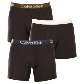 3PACK Moške boksarice Calvin Klein črne (NB2971A-GZ5) L.
Privoščite si ikonični slog in neprekosljivo udobje z moškimi boksericami Calvin Klein v brezčasnih barvah.
Sodobni materiali za največje udobje
Te boksarice so izdelane iz mešanice bombaža in umetnih vlaken.
Elegantna in funkcionalna zasnova za vsak dan
Elegantno obliko dopolnjuje tkan elastični trak s subtilnim logotipom Calvin Klein.
Zakaj ne smete zamuditi boksaric Calvin Klein

Mešanica bombaža in umetnih vlaken: Idealno razmerje med udobjem, vzdržljivostjo in prilagodljivostjo.
Eleganten videz s subtilnim logotipom Calvin Klein: Elegantna podlaga za vašo obleko.
Daljše noge in elastičen pas: Popolnoma se prilega in ostane na mestu brez neprijetnega zategovanja.

Spodnje perilo Calvin Klein obožujejo ljudje po vsem svetu
Moško spodnje perilo Calvin Klein je ena od stalnic modne industrije.
Kako skrbeti za boksarice Calvin Klein
Če želite, da bodo vaše najljubše boksarice dolgo ostale v odličnem stanju, vam priporočamo naslednje nasvete za vzdrževanje.

Pralnica: Per pri 30 °C.
Sušenje: Bokserje lahko sušite v sušilnem stroju, vendar priporočamo nizko temperaturo, da podaljšate življenjsko dobo elastičnih vlaken.
Likanje: Ni potrebna in ni priporočljiva.

Nasvet: Iskanje pravega spodnjega perila, ki se vam popolnoma prilega, je lahko izziv.